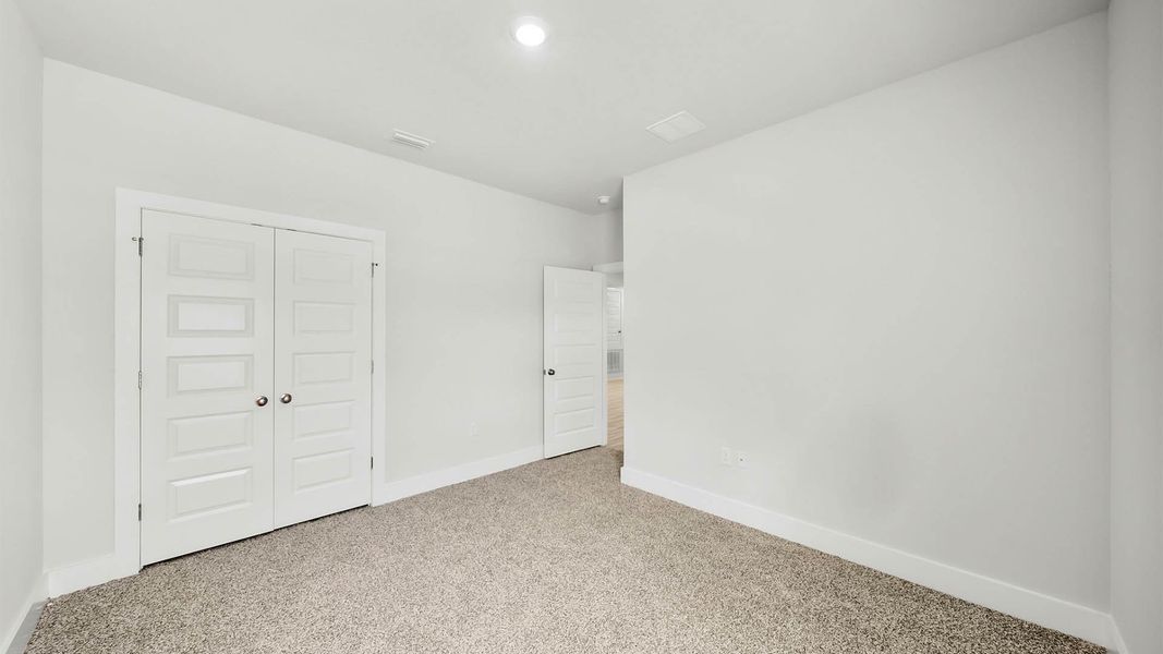 Representative unfurnished interior of a home built from the The Kennedy by D.R. Horton in Titus Park, Panama City (Image 25).