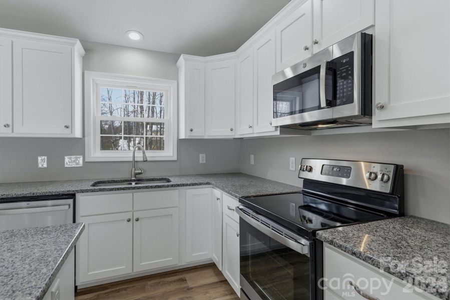 Furnished interior view inside a new home in , Lenoir (Image 9).