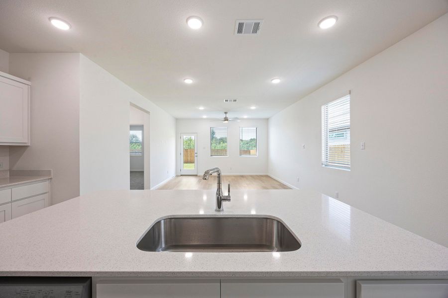 Kitchen in the Magnolia home plan by Trophy Signature Homes – REPRESENTATIVE PHOTO
