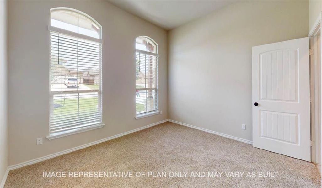 Spare room with light carpet Spare room with light carpet