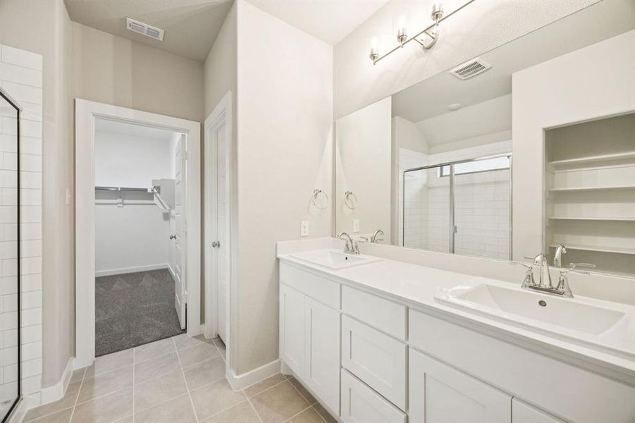 Primary Bathroom in the Oscar home plan by Trophy Signature Homes – REPRESENTATIVE PHOTO Primary Bathroom in the Oscar home plan by Trophy Signature Homes – REPRESENTATIVE PHOTO