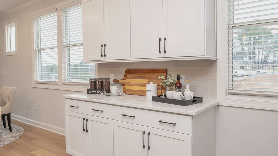 Representative furnished interior of a home built from the Cambridge by Epcon Communities in The Courtyards at Oak Grove, Durham (Image 12).
