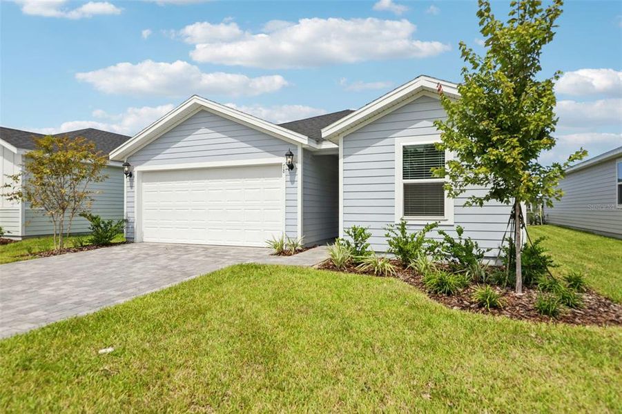 Front exterior of a new home in Colbert Landings, Palm Coast, FL, highlighting curb appeal (Image 18).