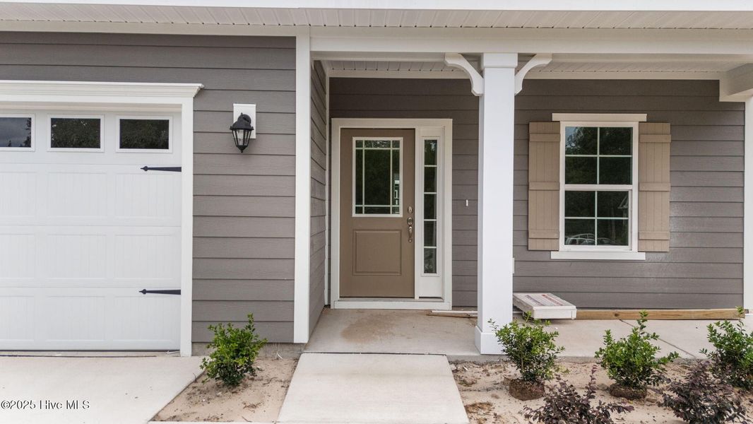 Front exterior of a new home in Rutledge, Shallotte, NC, highlighting curb appeal (Image 2).
