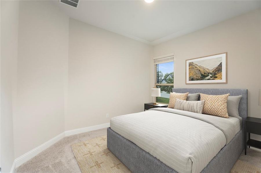 Bedroom with carpet flooring and baseboards