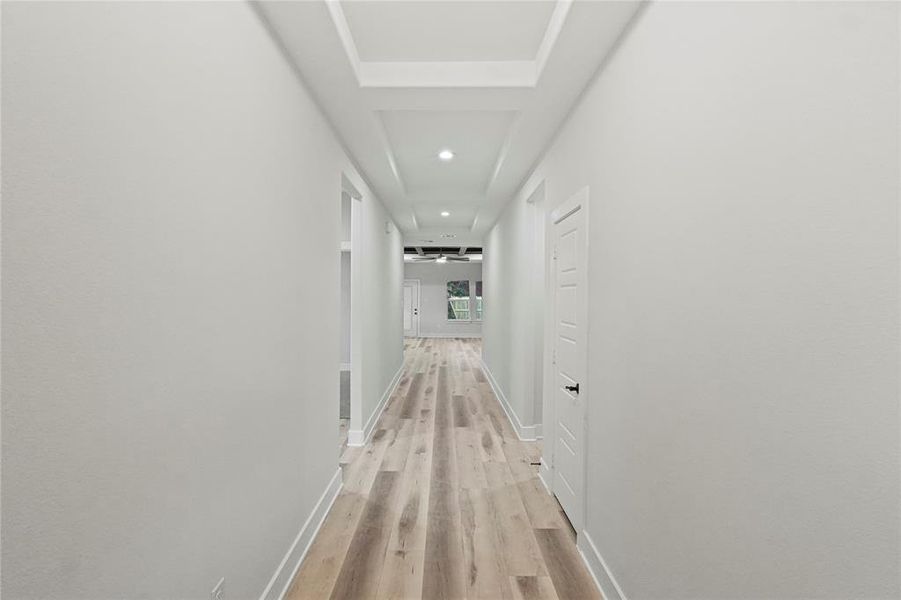 Hall with light hardwood / wood-style flooring