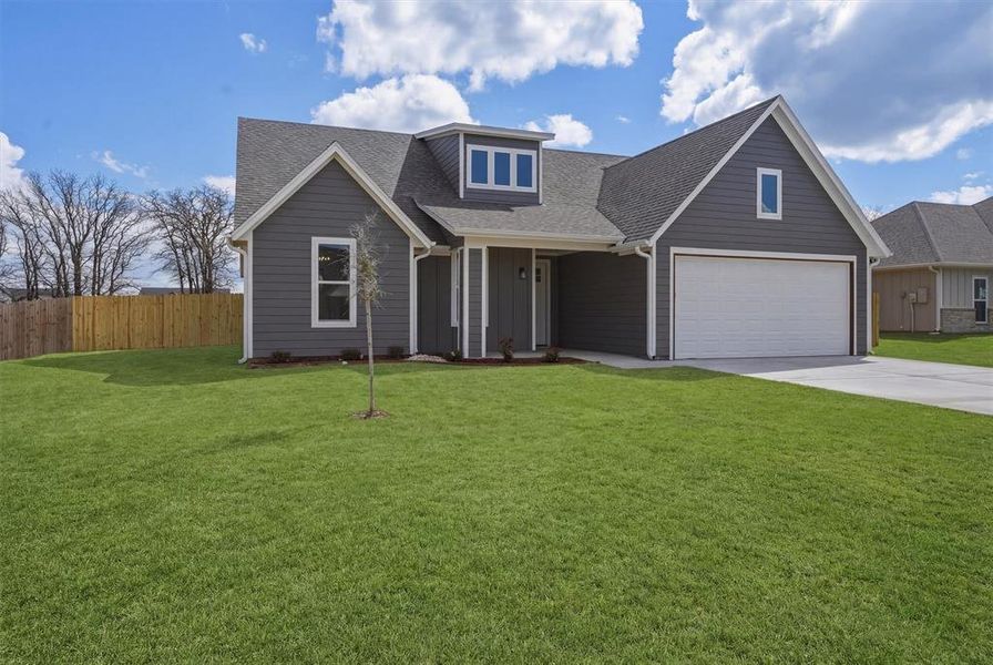 Front exterior of a new home in , Tolar, TX, highlighting curb appeal (Image 22). Front exterior of a new home in , Tolar, TX, highlighting curb appeal (Image 22).