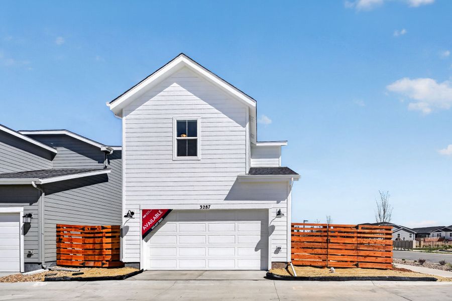 Front exterior of a new home in The Aurora Highlands, Aurora, CO, highlighting curb appeal (Image 17).