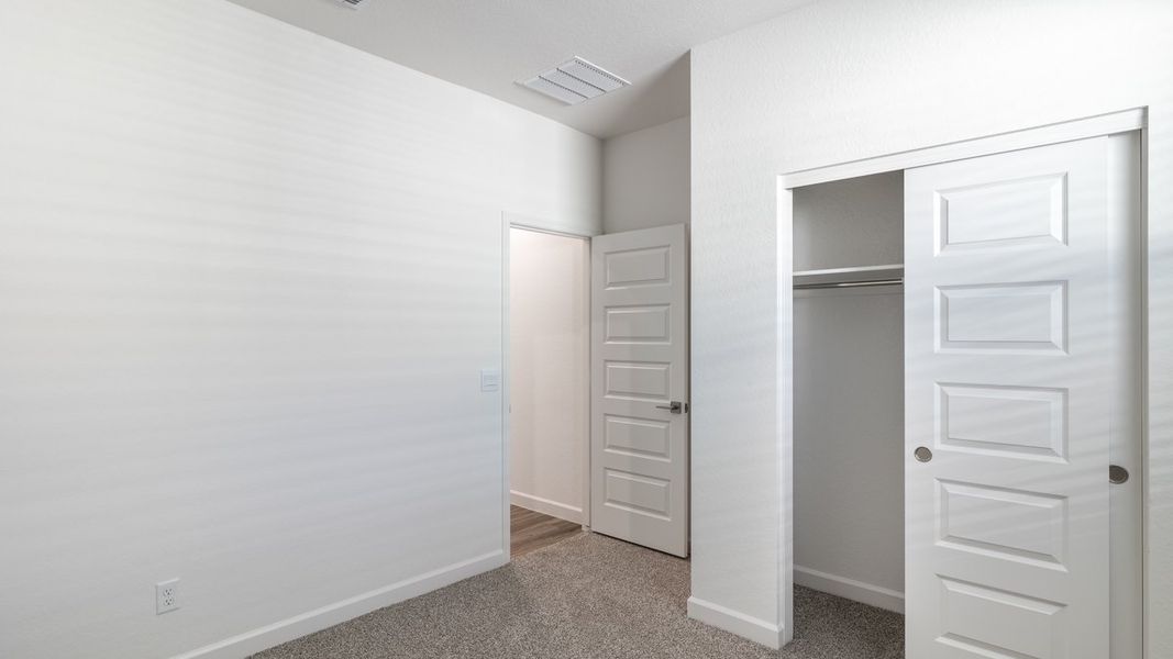 Spacious, unfurnished interior of a new home in Zanjero Pass, Waddell (Image 21).