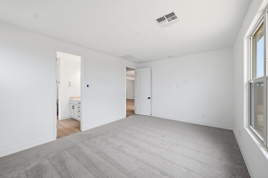 Spacious, unfurnished interior of a new home in Artisan at Asante, Surprise (Image 23).