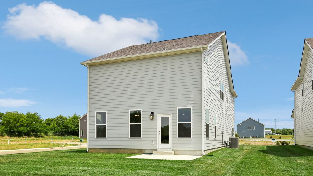 Backyard of home with small back patio