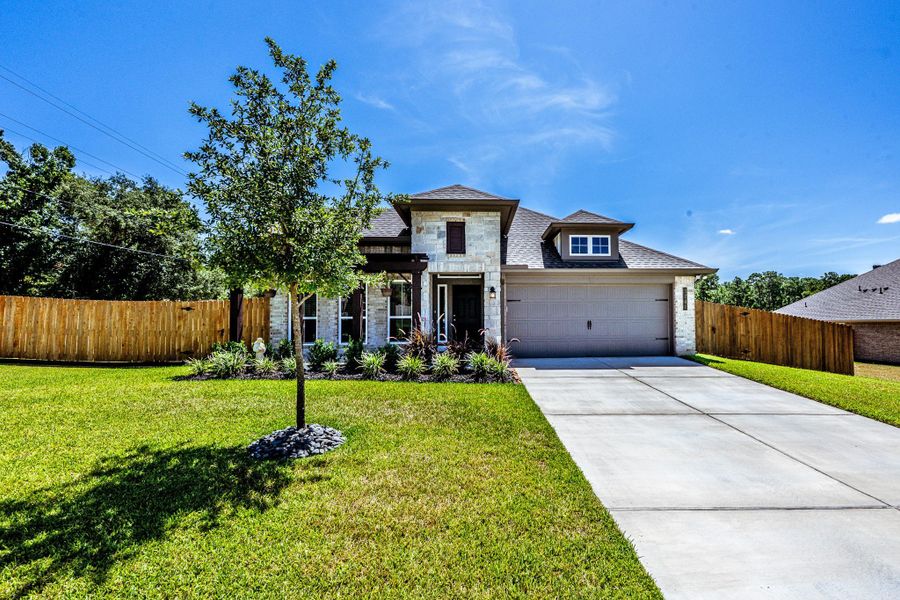 Front exterior of a new home in Spring Lake, Huntsville, TX, highlighting curb appeal (Image 2). Front exterior of a new home in Spring Lake, Huntsville, TX, highlighting curb appeal (Image 2).