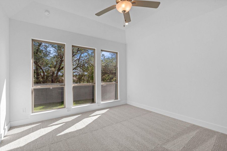 Primary Bedroom with elevated ceiling Primary Bedroom with elevated ceiling