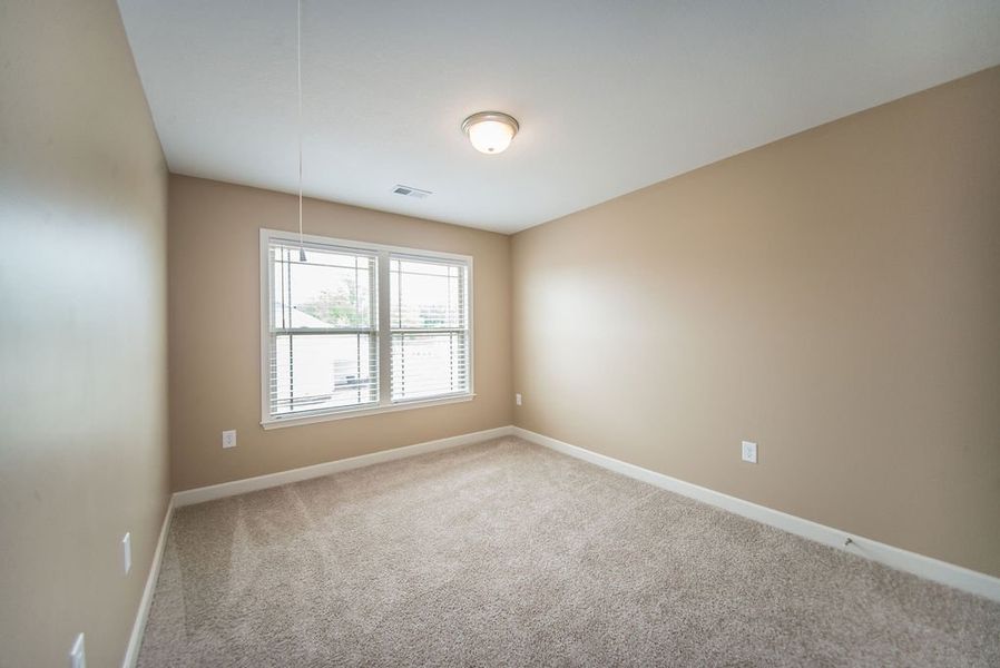 Representative unfurnished interior of a home built from the Reynolds by Enchanted Homes in Hampshire Heights, Moore (Image 33).