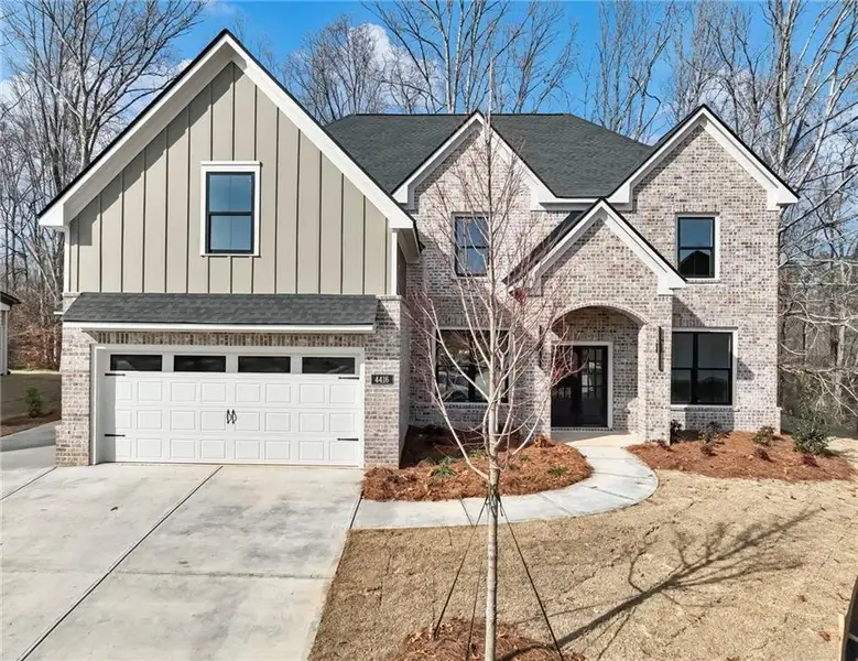 Front exterior of a new home in , Buford, GA, highlighting curb appeal (Image 1). Front exterior of a new home in , Buford, GA, highlighting curb appeal (Image 1).