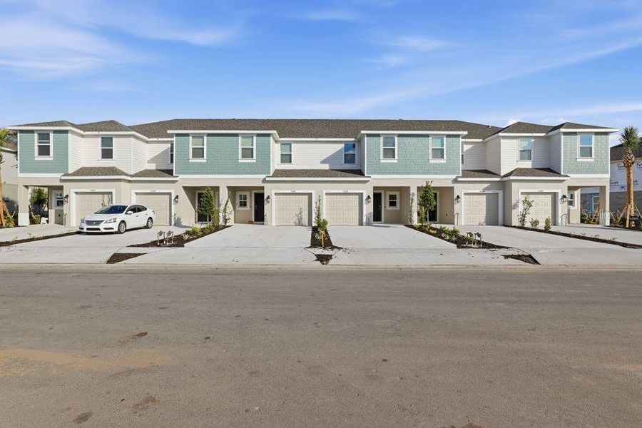 Front exterior of a new home in The Towns at Firethorn, Parrish, FL, highlighting curb appeal (Image 27).