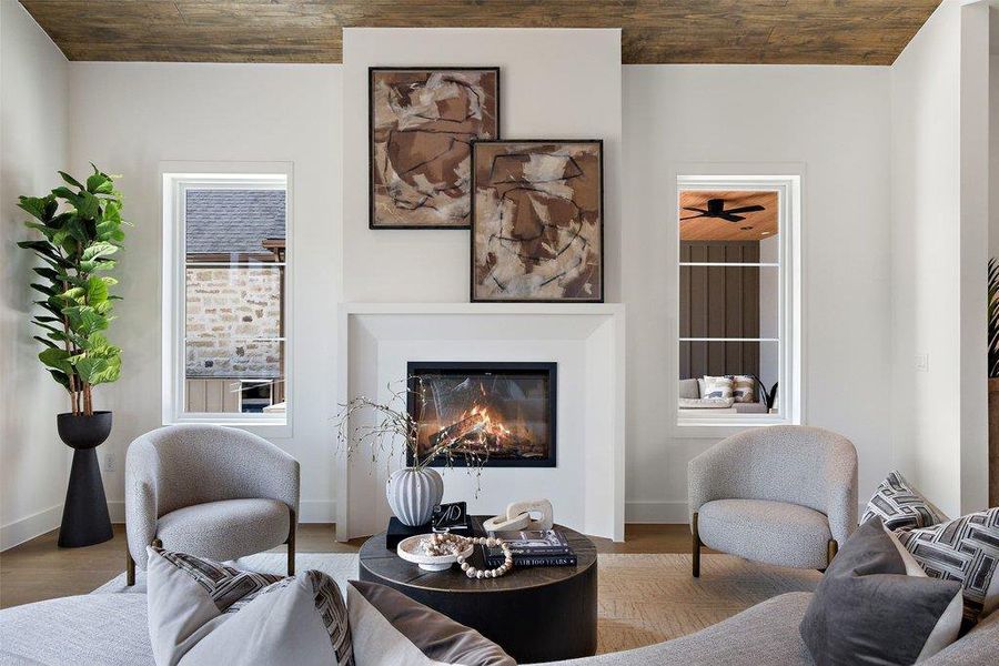 A striking fireplace forms the focal point of this inviting living area.