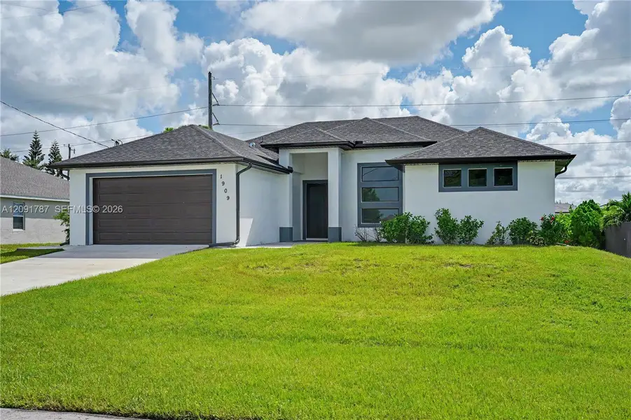 Front exterior of a new home in , Cape Coral, FL, highlighting curb appeal (Image 1). Front exterior of a new home in , Cape Coral, FL, highlighting curb appeal (Image 1).