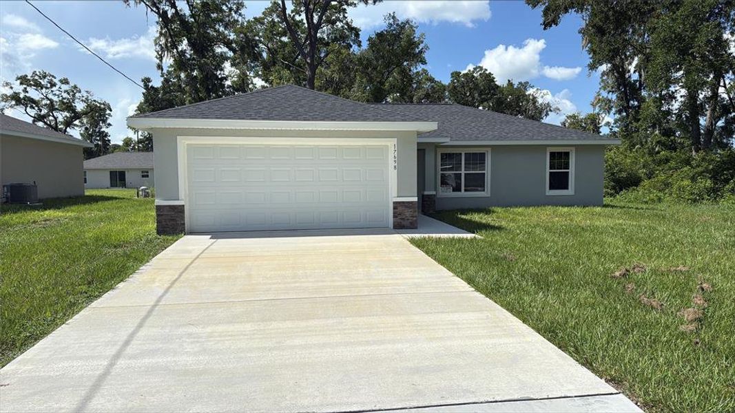 Front exterior of a new home in , Dunnellon, FL, highlighting curb appeal (Image 15). Front exterior of a new home in , Dunnellon, FL, highlighting curb appeal (Image 15).
