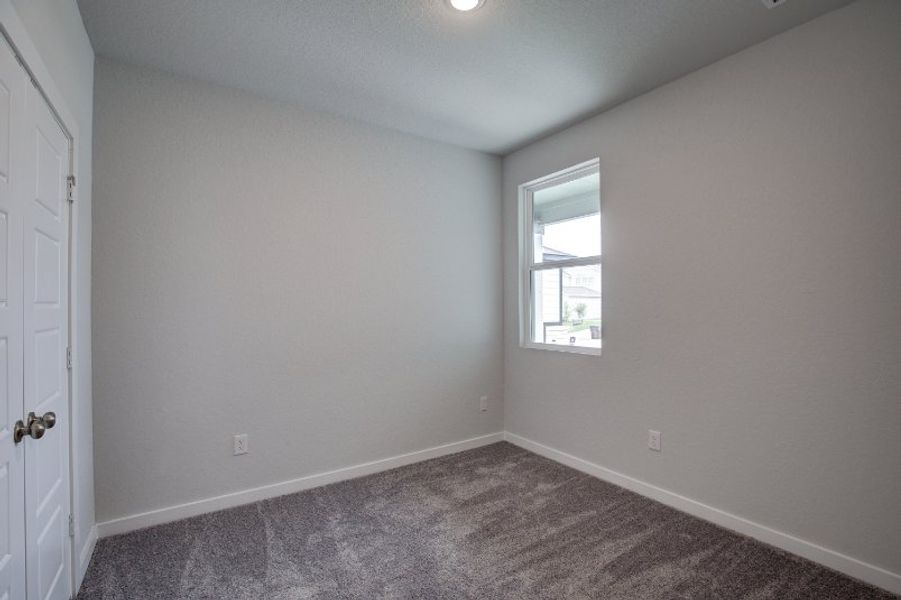 A room with a door and a window.