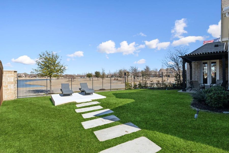 Front exterior of a new home in South Pointe, Mansfield, TX, highlighting curb appeal (Image 2). Front exterior of a new home in South Pointe, Mansfield, TX, highlighting curb appeal (Image 2).