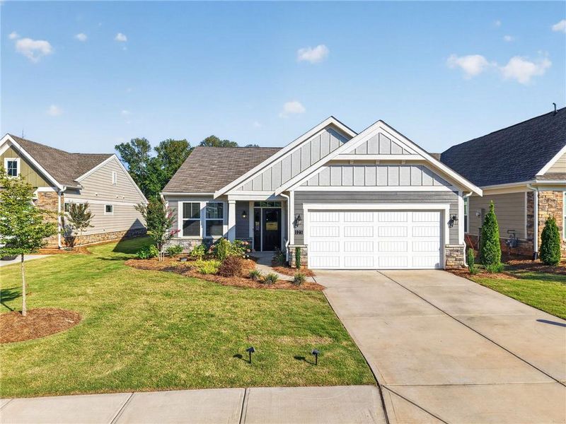 Front exterior of a new home in Laurel Farms, Dallas, GA, highlighting curb appeal (Image 19).