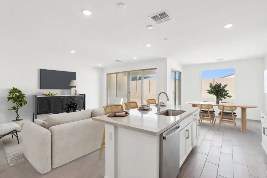 Great room, kitchen & dining - Timeless Collection. Virtually staged. Finishes may vary by community
