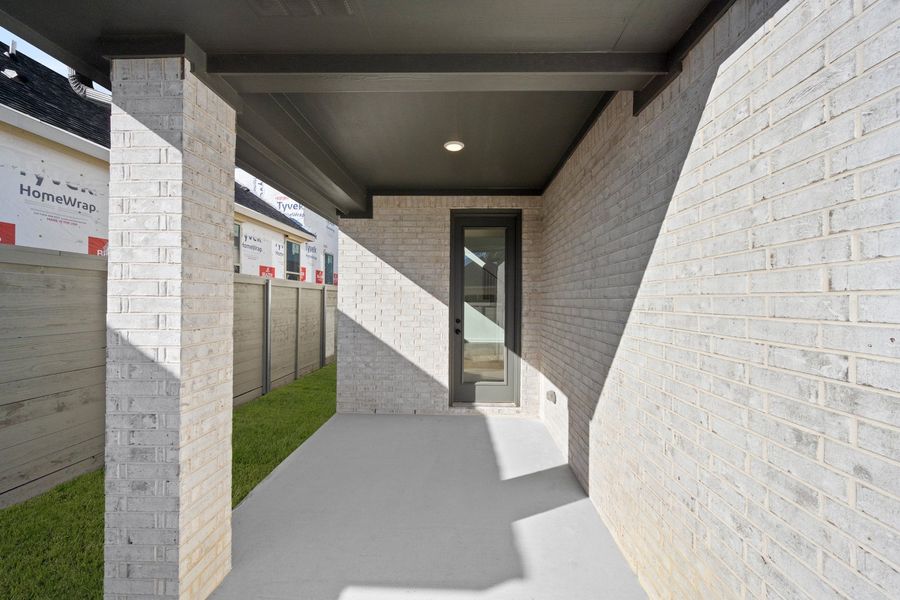 Exterior details and patio area of a home in Treeline, Justin (Image 4).