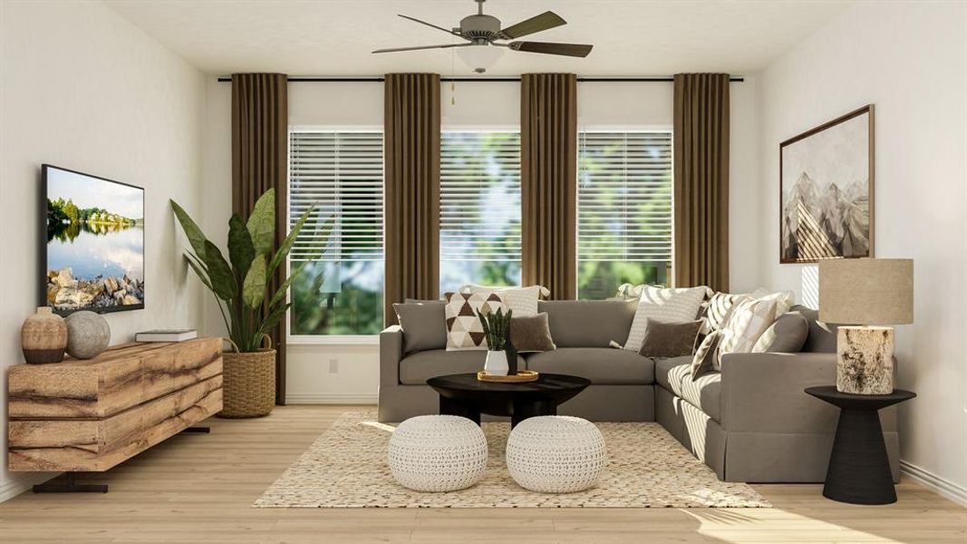 Living room with light hardwood / wood-style flooring and ceiling fan