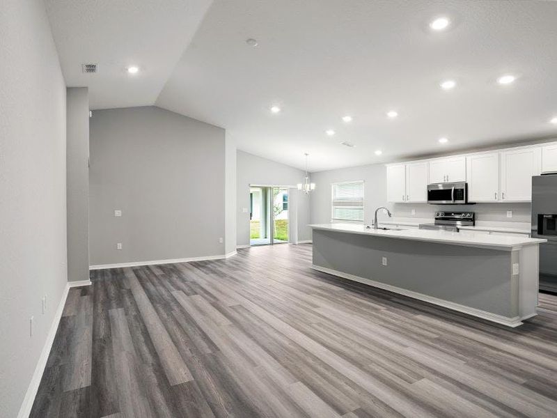 Enjoy a sunny, open living area with volume ceilings - Paisley by Highland Homes