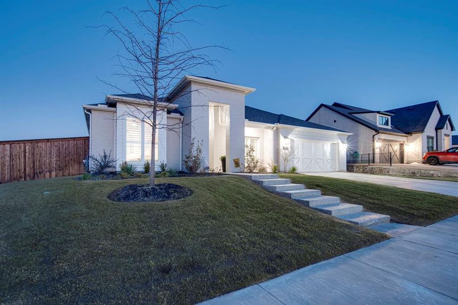 Front exterior of a new home in Sweetgrass, Haslet, TX, highlighting curb appeal (Image 23).