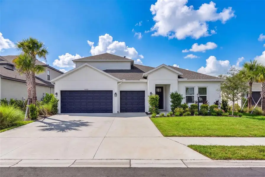 Front exterior of a new home in , Bradenton, FL, highlighting curb appeal (Image 28).