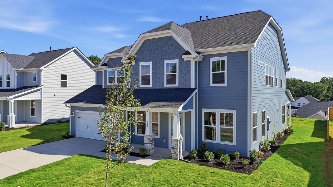 Front exterior of a new home in Kayfield at Midway, Anderson, SC, highlighting curb appeal (Image 2). Front exterior of a new home in Kayfield at Midway, Anderson, SC, highlighting curb appeal (Image 2).