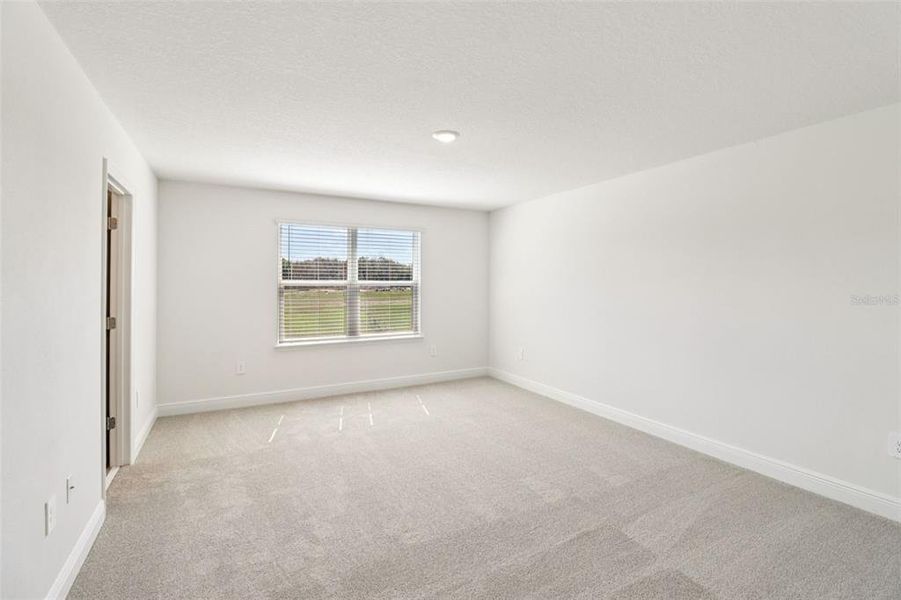 Spacious, unfurnished interior of a new home in The Reserve at Hammock Oaks - Classic Series, Lady Lake (Image 27).