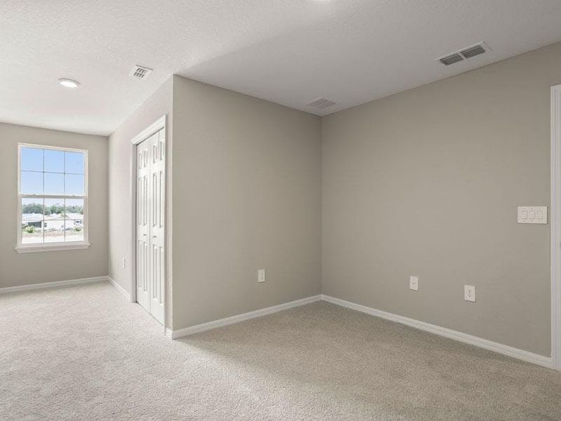 Large secondary bedrooms provide space for everyone in your household - Aruba townhome by Highland Homes