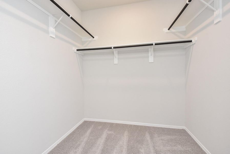 This is your amazing carpeted primary walk-in closet. This is your amazing carpeted primary walk-in closet.