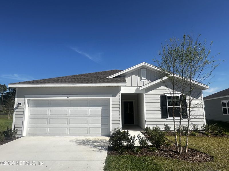 Front exterior of a new home in , Palm Coast, FL, highlighting curb appeal (Image 1). Front exterior of a new home in , Palm Coast, FL, highlighting curb appeal (Image 1).