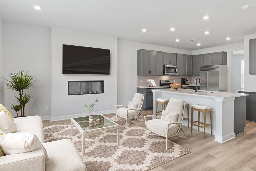 A kitchen with a tv and chairs. A kitchen with a tv and chairs.