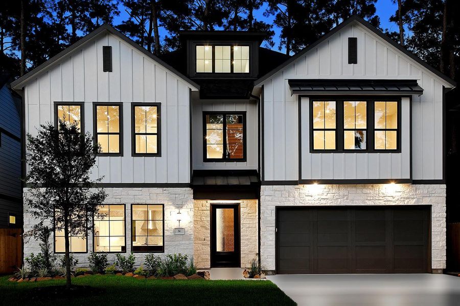 Front exterior of a new home in , The Woodlands, TX, highlighting curb appeal (Image 1). Front exterior of a new home in , The Woodlands, TX, highlighting curb appeal (Image 1).