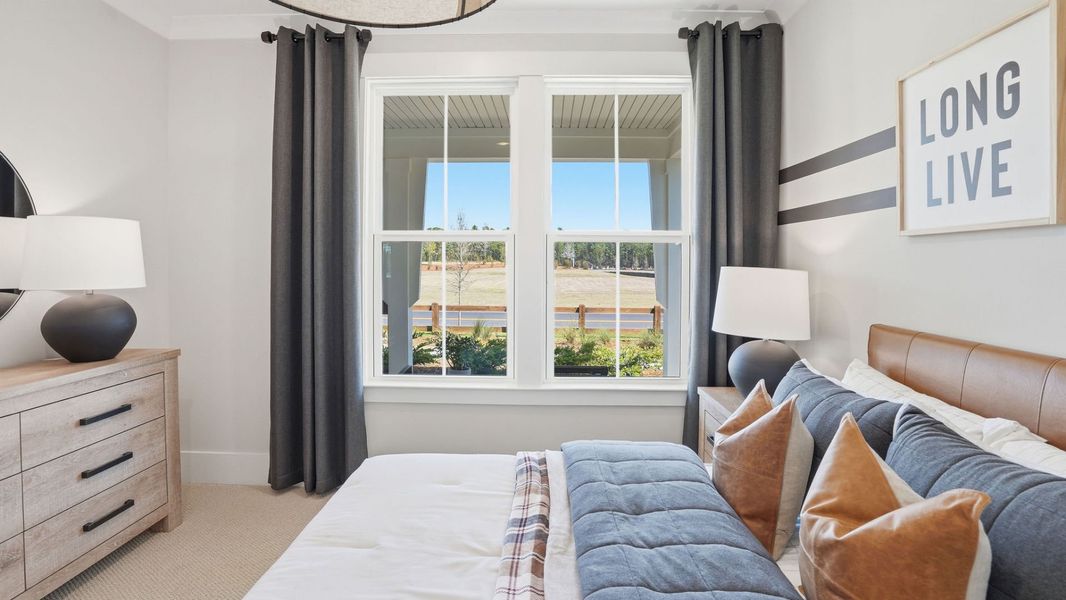 Representative furnished interior of a home built from the Mystique by Del Webb in Del Webb Point Hope, Charleston (Image 13).