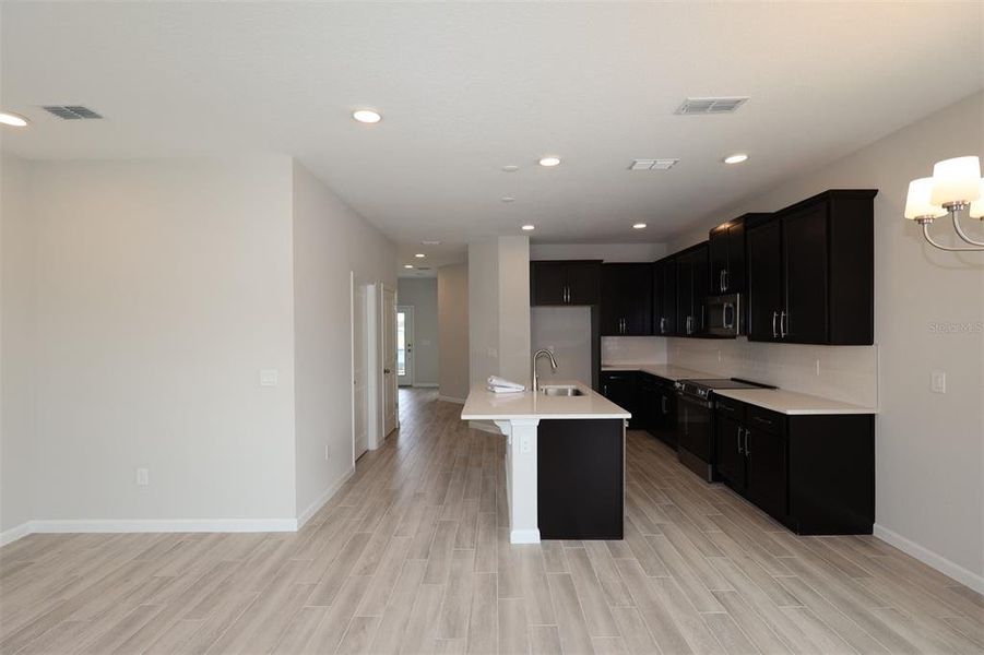 Furnished interior view inside a new home in Center Lake on the Park, St. Cloud (Image 11).