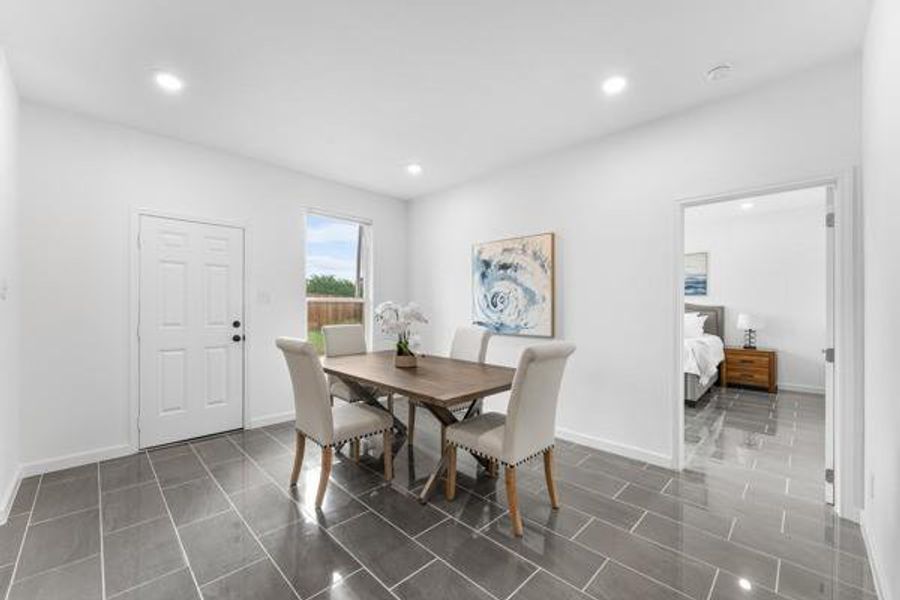 Dining space featuring recessed lighting and baseboards Dining space featuring recessed lighting and baseboards