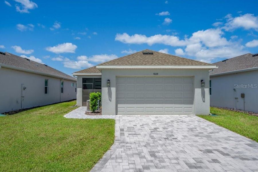 Front exterior of a new home in , Sarasota, FL, highlighting curb appeal (Image 20).