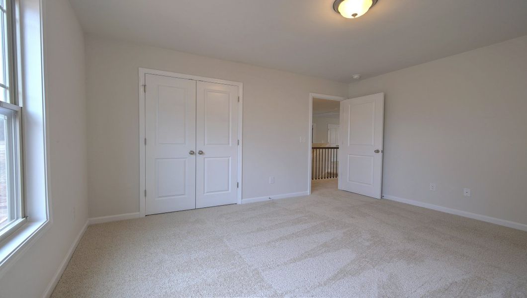 Spacious, unfurnished interior of a new home in Reserve at Tap Root Farms, Fletcher (Image 38).
