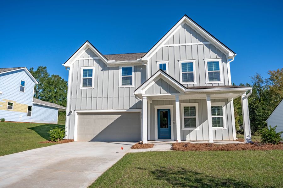 Front exterior of a new home in Carriage Estates, Lexington, SC, highlighting curb appeal (Image 1). Front exterior of a new home in Carriage Estates, Lexington, SC, highlighting curb appeal (Image 1).