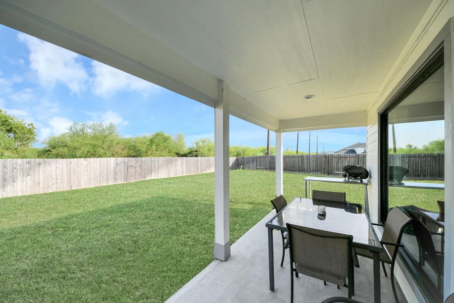 Covered outdoor patio perfect for outdoor lounge seating and evening barbecues.
