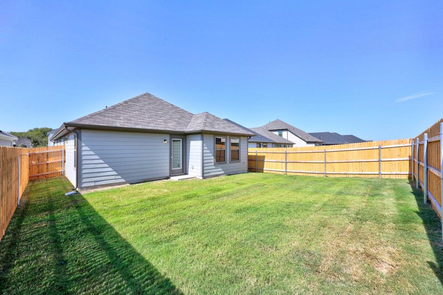 Exterior details and patio area of a home in Trinity Ranch, Elgin (Image 3).