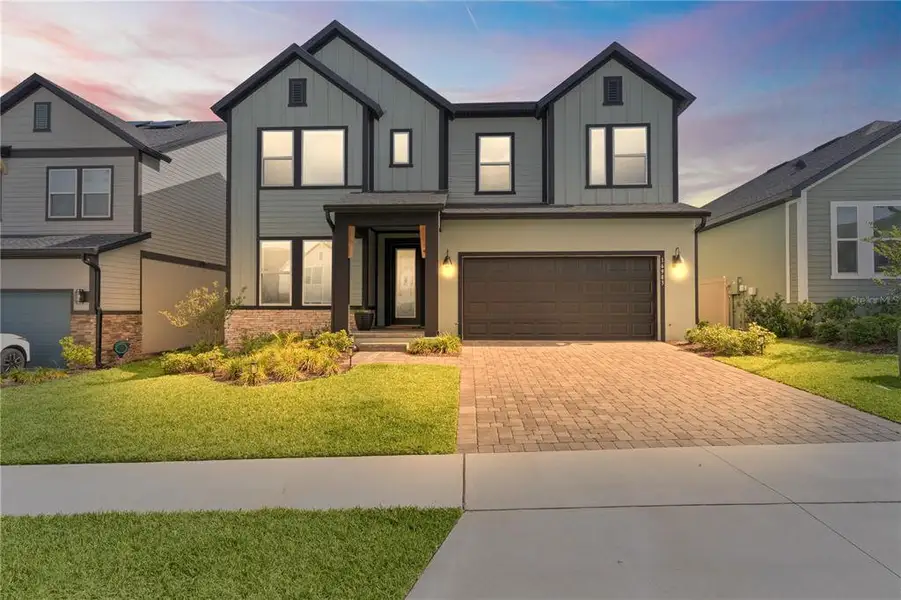 Front exterior of a new home in , Clermont, FL, highlighting curb appeal (Image 22).