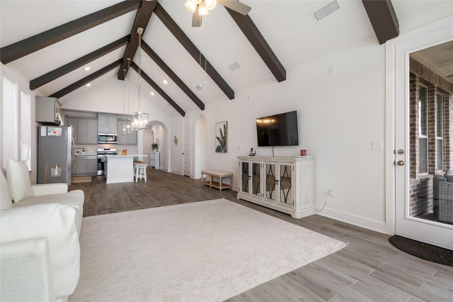 Sleek tile flooring throughout with direct access to the patio and backyard.