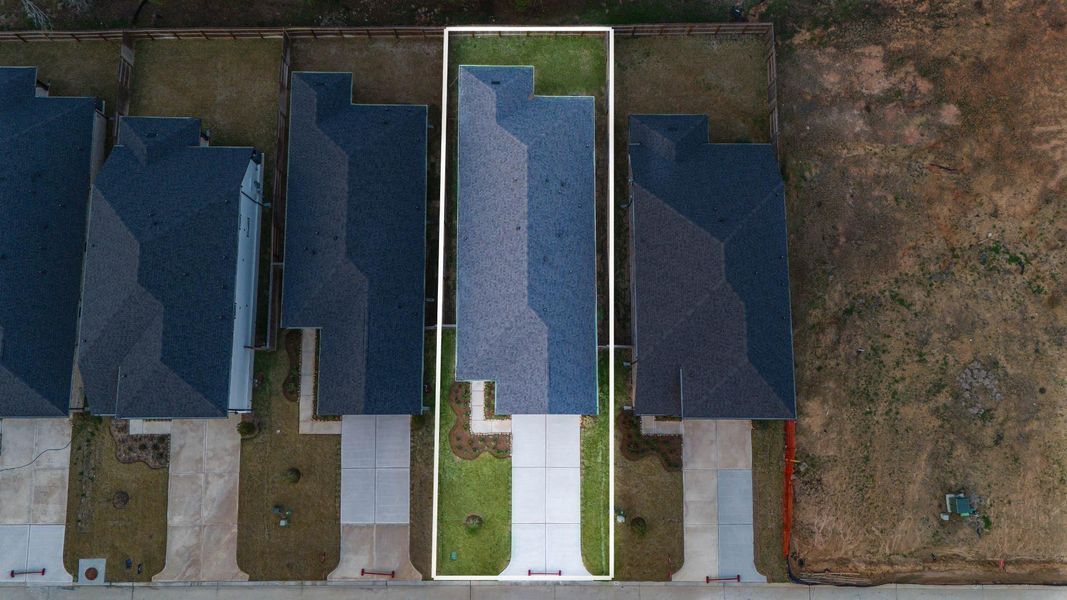 This home sits on a large lot with ample yard space in front and the back, lush landscaping and well-maintained yard!